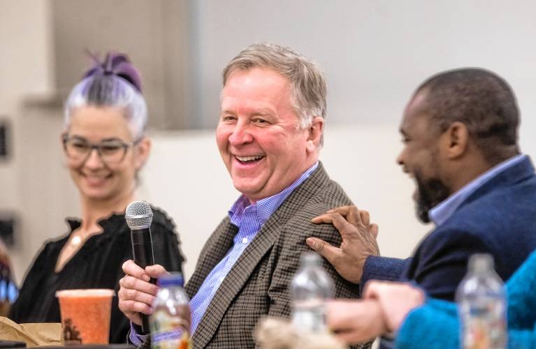 Incoming Concord city councilor Jeff Foote, center, from Ward 10 gets a laugh as he introduces himself to the group during a council orientation at the community center in Concord on Wednesday night. Incoming councilors Michele Horne, left and Ali Sekou look on.
