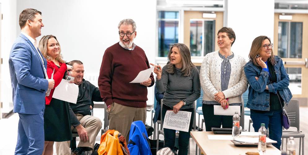City councilors Nathan Fennessy (left), Amanda Grady Sexton, Mayor Byron Champlin, Stacey Brown, Judith Kurtz, and Jennifer Kretovic (all standing) are part of the green group forthe exercise in personality types at the council orientation at the Concord Community Center on Wednesday night, January 3, 2024.