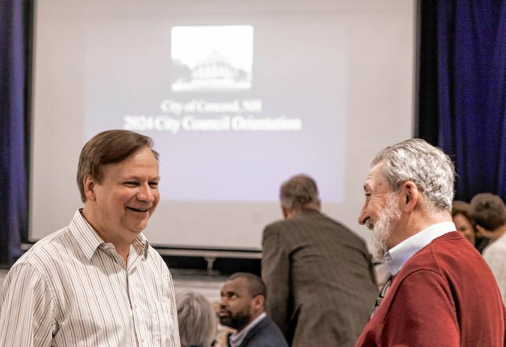 City councilor Brent Todd talks with Concord Mayor Byron Champlin before the start of the council orientation at the Community Center on Wednesday night, January 3, 2024.