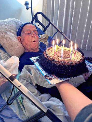 Lou Sillari blows out the candles on his 108th birthday last month.