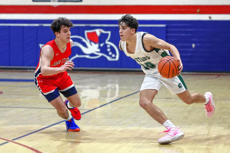 Pembroke senior Joe Fitzgerald drives to the basket during the Spartans’ Capital Classic third-place game against John Stark on Dec. 29.