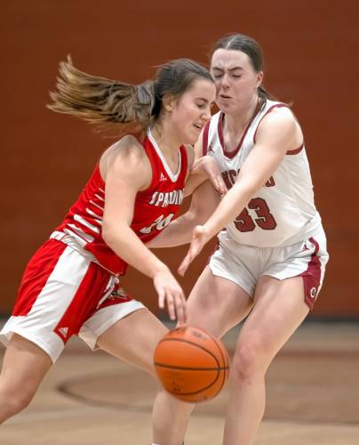 Concord guard Delaney Duford draws an offensive foul against Spaulding guard Anna Stanley during the first half on Friday night, January 5, 2024.