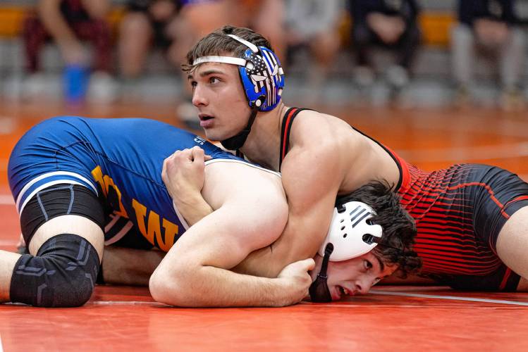 Campbell’s Lucas Allaire (top) and Bow’s Ben McDowell (bottom) wrestle in the championship round at 165 pounds at the Keene High Minickiello Tournament on Saturday. Allaire won the 165 title with a pin in the first period, but Bow tied for third out of 27 teams.