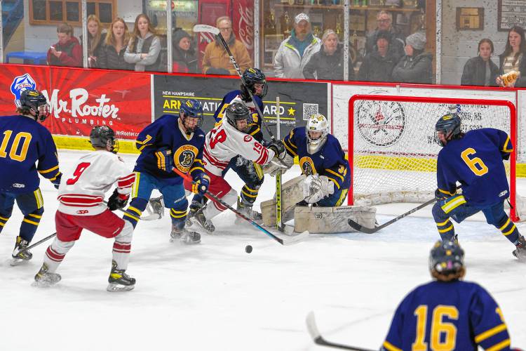 Bow goalie Mason Marquis tracks the puck during a net-mouth scramble during Wednesday's matchup with Bow at Everett Arena. Marquis turned aside 26 of the 28 shots he faced in the Falcons' 2-1 loss.