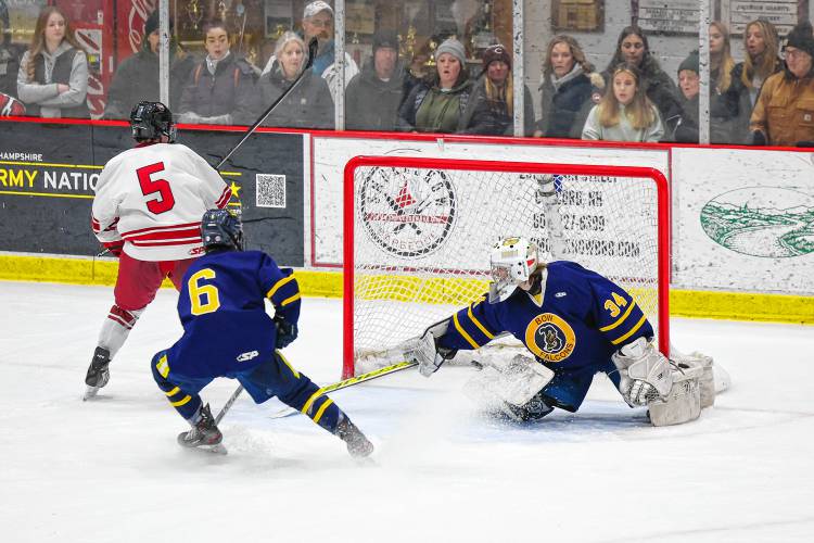 Concord freshman Jaden Haas slides the puck past Bow goalie Mason Marquis to put the Tide ahead 2-1 with 2:01 remaining in the third period of Wednesday's matchup.