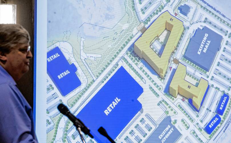 Doug Richardson, executive vice president of Onyx Partners, show a rendition of the plans for the Steeplegate Mall site at the Greater Concord Chamber of Commerce luncheon presentation of both the Steeplegate and Monitor Way projects on Thursday in Concord.