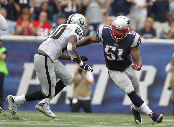 FILE - Oakland Raiders running back Darren McFadden (20) blocks New England Patriots middle linebacker Jerod Mayo (51) in the fourth quarter of an NFL football game Sunday, Sept. 21, 2014, in Foxborough, Mass. The New England Patriots have agreed to hire Jerod Mayo to succeed Bill Belichick as their next head coach, according to a person familiar with the situation. Details were still being worked out on Friday, Jan. 12, 2024, according to the person, who spoke on the condition of...