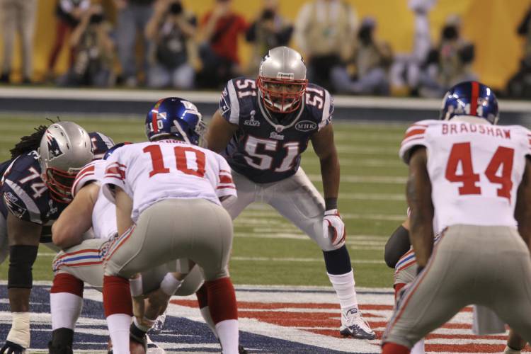 FILE - New England Patriots Jerod Mayo (51) looks over the line of scrimmage against the New York Giants at Super Bowl XLVI on Sunday, Feb. 5, 2012, in Indianapolis. The New England Patriots have agreed to hire Jerod Mayo to succeed Bill Belichick as their next head coach, according to a person familiar with the situation. Details were still being worked out on Friday, Jan. 12, 2024, according to the person, who spoke on the condition of anonymity because the team hasn't announced...