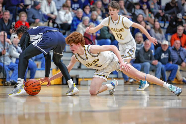 Bow senior Colby Smith dives for a loose ball during the Falcons’ 72-57 win over Milford on Friday night.