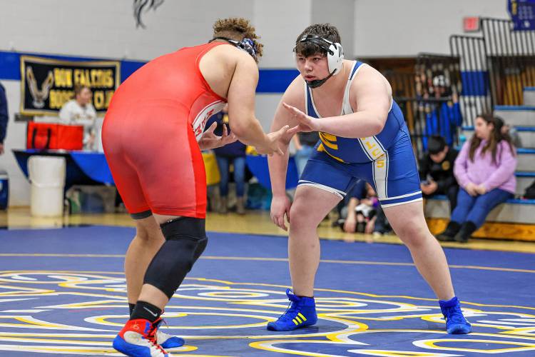 Bow's Hunter Hutchinson (right) plans his attack against an opponent from Manchester Memorial at the Bow quad meet on Saturday, Jan. 13, 2024. Hutchinson won all three bouts, two by pin and one by decision in the 285-pound class to help lead Bow past Manchester Central, 69-12, Manchester Memorial, 45-12, and Bishop Guertin, 43-32. Chip Griffin / Photos By Chip