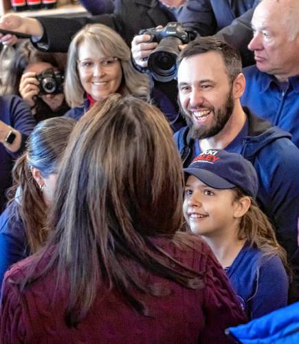 Ten-year-old Hannah Kesselring gets to meet her top candidate, former Governor NIkki Haley with her father at Robieâs County Store in Hooksett on Thursday, January 18, 2024. The room was packed with journalists and potential but Haley was sure to come by and say hello to Hannah and sign posters as well.