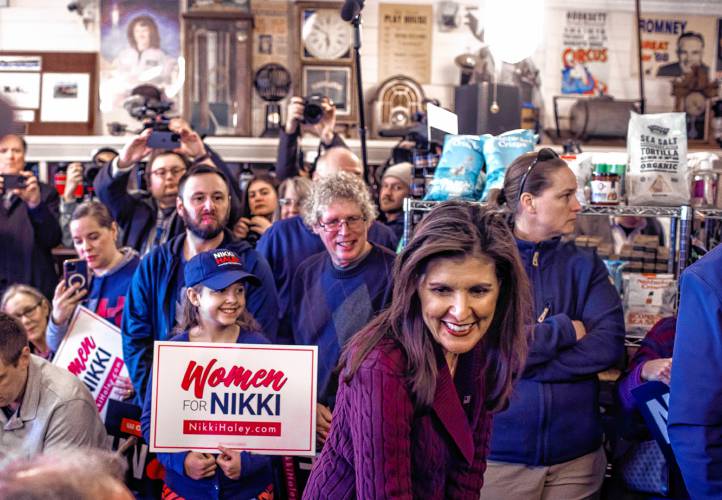 Ten-year-old Hannah Kesselring gets to meet her top candidate, former Governor NIkki Haley with her father at Robieâs County Store in Hooksett on Thursday, January 18, 2024. The room was packed with journalists and potential but Haley was sure to come by and say hello to Hannah and sign posters as well.