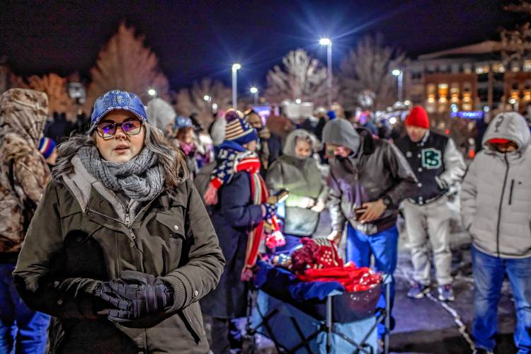 Amber Demmer of Concord waits in line outside the Courtyard by Marriot in Concord on her way to getting to see former President Donald Trump for the first time on Friday night, January 19, 2024.