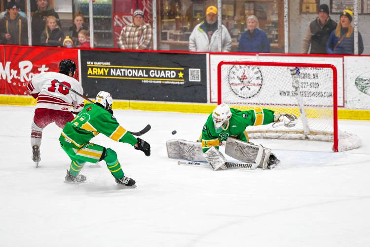 Concord’s Dawson Fancher (10) scores against Bishop Guertin on Saturday at Everett Arena. Fancher had two goals and two assists to lead the Crimson Tide to a 5-1 victory.