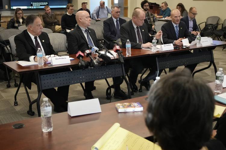 Members of the Sagadahoc County Sheriff's Department are questioned, Thursday, in Augusta, Maine, during a hearing of the independent commission investigating the law enforcement response to the mass shooting in Lewiston, Maine. Seated left to right is Sheriff Joel Merry, Chief Deputy Brett Strout, Sgt. Aaron Skolfield, and Deputy Chad Carleton.