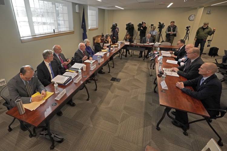 Members of the Sagadahoc County Sheriff's Department, seated at table at right, are questioned, Thursday, Jan. 25, 2024, in Augusta, Maine, during a hearing of the independent commission investigating the law enforcement response to the mass shooting in Lewiston, Maine.(AP Photo/Robert F. Bukaty)