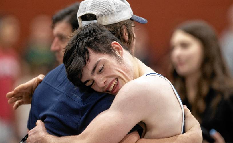 Bow senior Ben McDowell gets a hug after his semifinal victory at the Capital City Classic on Saturday. McDowell finished second at 165.