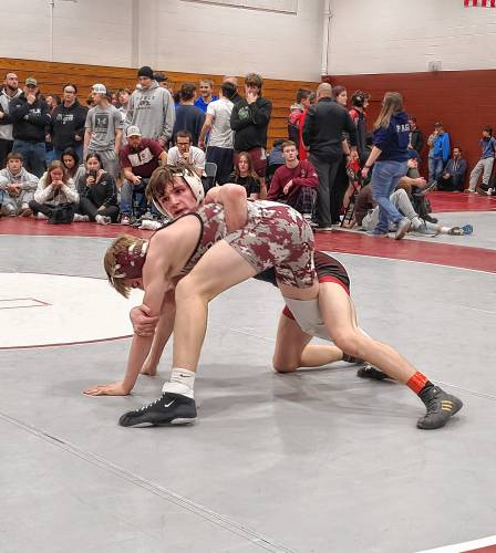 Concord’s Cullen Burke looks to his coach while wrestling Noble, Maine’s Owen Gray in the 120-pound finals at the Capital City Classic on Saturday. Burke won the match and the title with a 10-6 decision.
