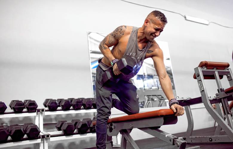 Mark Vincent gets in a workout before going to work at the front desk of the Capital City Sports and Fitness on Friday, January 19, 2024.