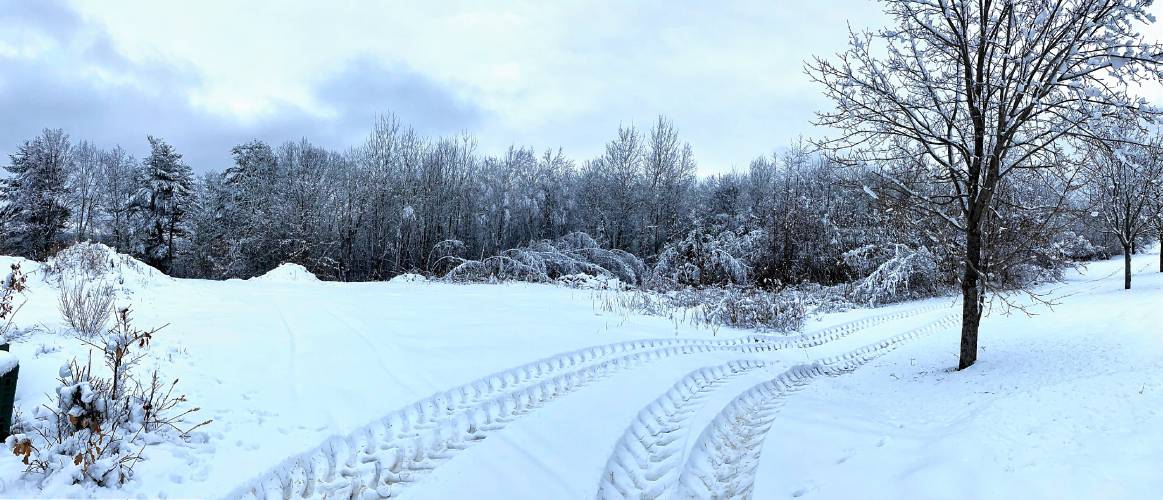 Truck tire tracks weave through an open area off of an industrial park off of Route 3 in Bow on Tuesday, January 30, 2024.