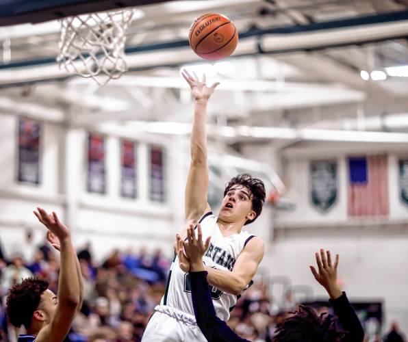 Pembroke guard Joe Fitzgerald scores at the rim during the first half against Manchester West on Tuesday night, January 30, 2024.