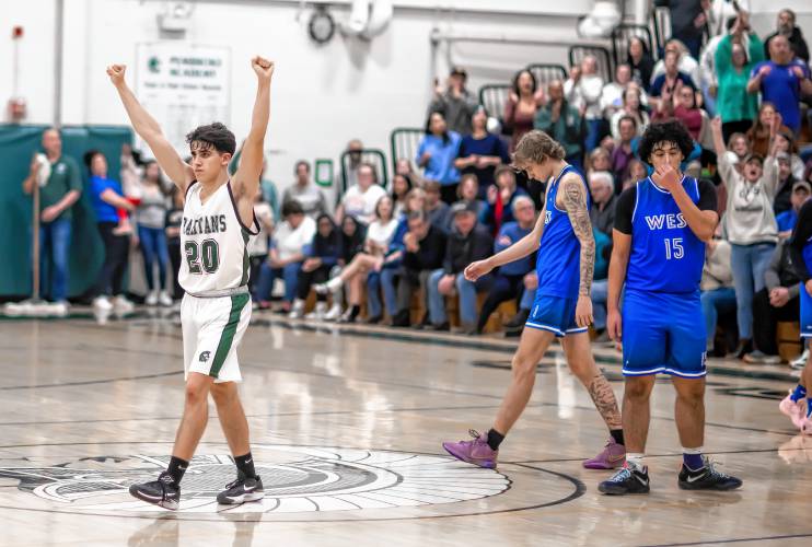 Pembroke guard Joe Fitzgerald (20) starts the celebration after the Spartans rebounded in overtime for a narrow home win over Manchester West.