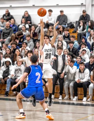 Pembroke guard Joe Fitzgerald scores a 3-pointer during the second half against Manchester West on Tuesday night, January 30, 2024.