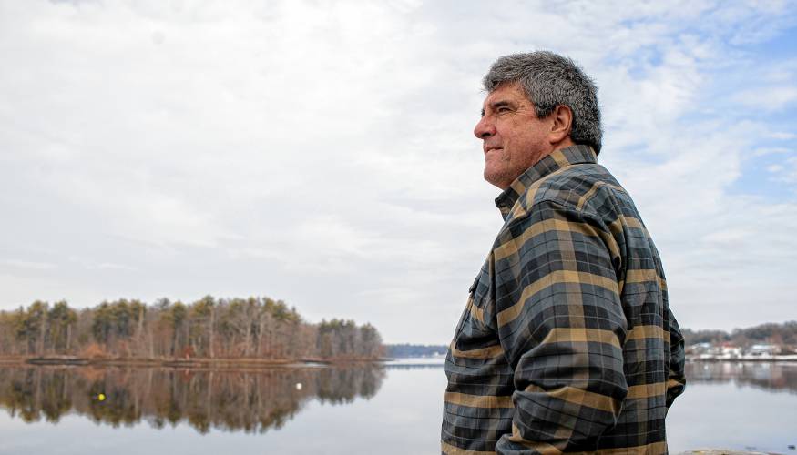 Dennis Pratt enjoys his morning coffee on the deck of their condo near Dover Point in Dover on Thursday.