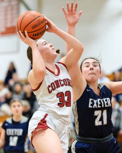 Concord's Delaney Duford (33) goes up for a shot against Exeter in a home game on Monday, Feb. 5, 2024. Duford scored 13 points to help lead Concord to a 60-42 victory.  CHIP GRIFFIN / Photos By Chip