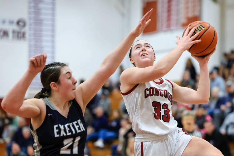 Concord's Delaney Duford (33) goes up for a shot against Exeter in a home game on Monday, Feb. 5, 2024. Duford scored 13 points to help lead Concord to a 60-42 victory.  CHIP GRIFFIN / Photos By Chip