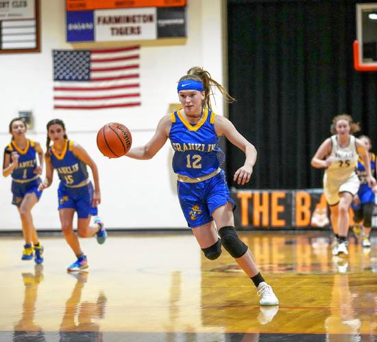 Franklin’s Kourtney Kaplan (12) goes on a fast break during a Dec. 17 game in Farmington.
