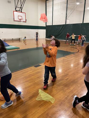 Felix Gage hopes to catch the scarf.