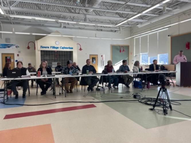 Around 100 residents attended Saturday’s deliberative session in the Weare Middle School cafeteria.
