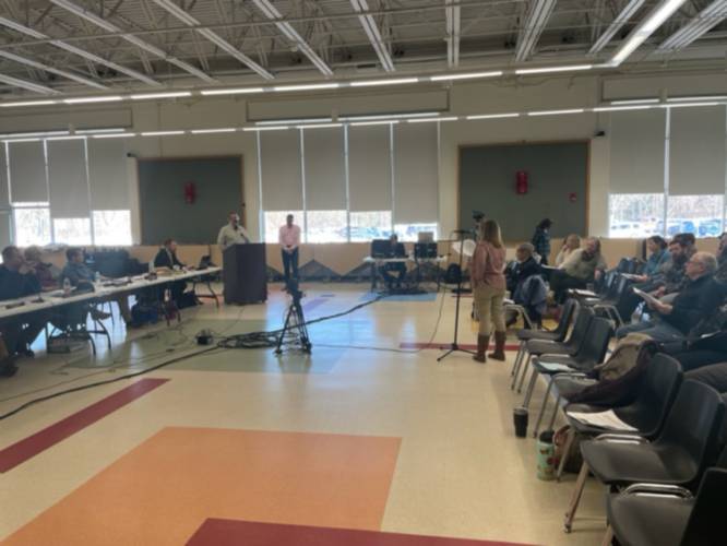 Around 100 residents attended Saturday’s deliberative session in the Weare Middle School cafeteria.