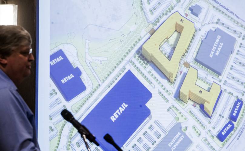 Doug Richardson, executive vice president of Onyx Partners, show a rendition of the plans for the Steeplegate Mall site on January 11.