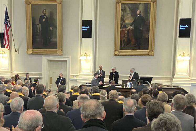 House Speaker Sherman Packard (right) honors Canadian Consul General in Boston Bernadette Jordan (center) shortly after Jordan delivered a speech to the New Hampshire House on Feb. 8.