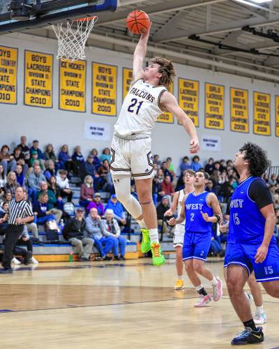 Bow’s Peyton Larrabee dunks against Manchester West on Tuesday at Bow High School. Bow defeated West, 58-44.