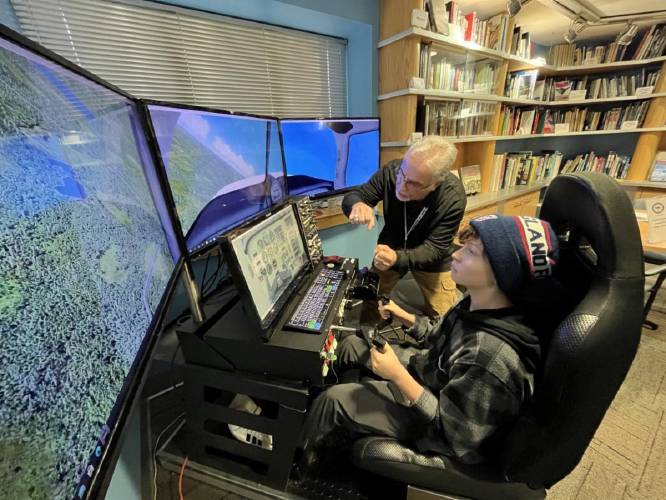 Students work on activities at the Aviation Museum of N.H.