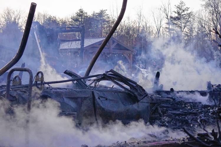 Due to high winds, a fire that began in the garage quickly spread to the entirety of a four-bedroom home on Barton Corner Road in Hopkinton Wednesday afternoon. Its occupants, a woman and two dogs, were able to safely evacuate, according to Hopkinton Fire Department, but the home was destroyed. 