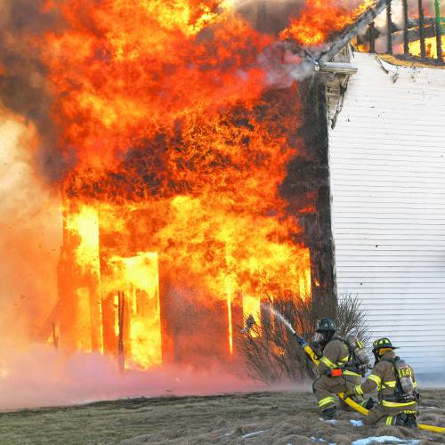 A fire that began in the garage quickly spread to the entirety of a four-bedroom home on Barton Corner Road in Hopkinton Wednesday afternoon. A woman and two dogs were able to safely evacuate, according to Hopkinton Fire Department, but the home was destroyed.
