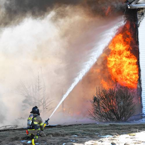 A fire that began in the garage quickly spread to the entirety of a four-bedroom home on Barton Corner Road in Hopkinton on Wednesday.