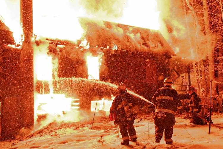 A two-alarm fire in Warner destroyed a log cabin on Marsh Lane just before 8 p.m on Thursday, Feb. 15.