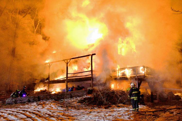 A two-alarm fire in Warner destroyed a log cabin on Marsh Lane just before 8 p.m..