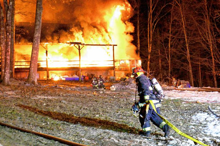 A two-alarm fire in Warner destroyed a log cabin on Marsh Lane just before 8 p.m..