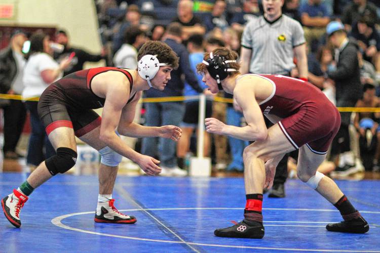 Concord’s Griffin Norwalt (left) wrestles Timberlane’s Cam Pettengill during the 126 quarterfinal in Saturday’s Division I wrestling championship at Londonderry High School.