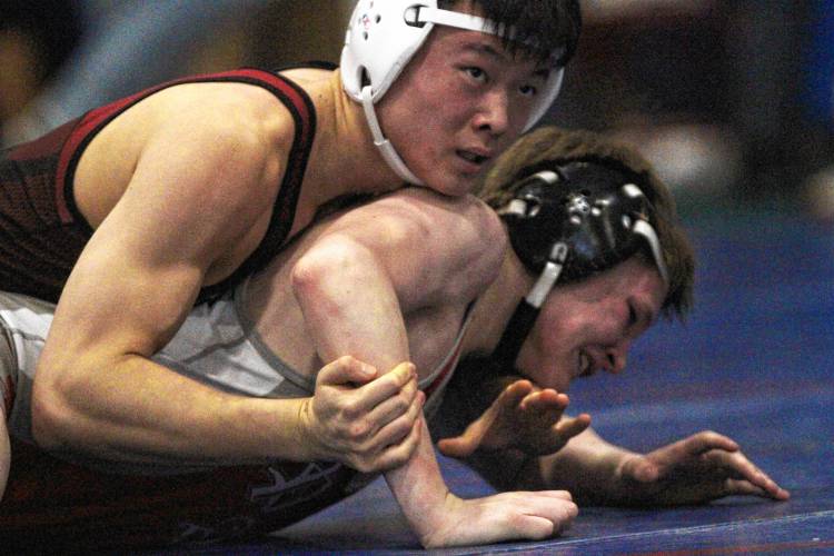 Concord’s Max Chung pins Pinkerton’s Connor Combs in the 150-pound round of 16 during Saturday’s Division I wrestling championship at Londonderry High School.