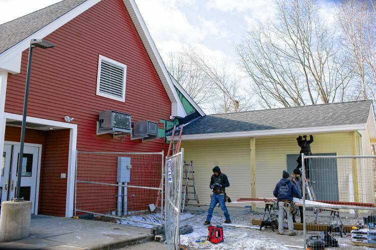 Construction of the expanded area off of the Friendly Kitchen main building which will house a storage area.