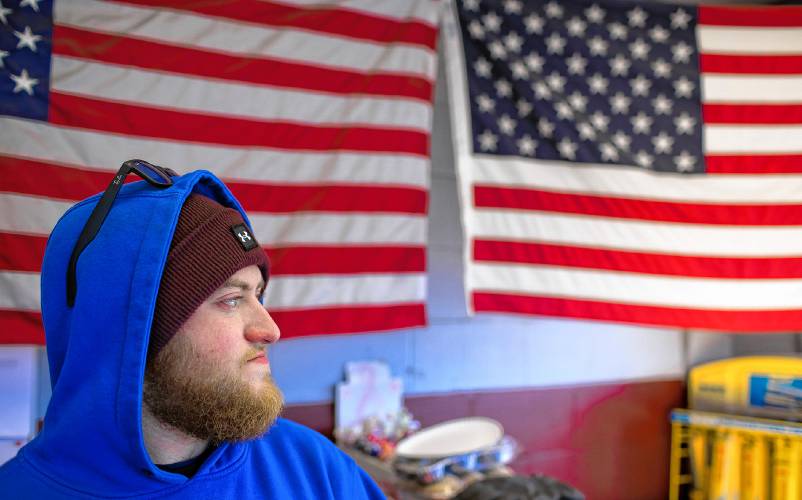 Derek Contarino waits for customers to pump gas inside the station on Tuesday, February 20, 2023. Derek Contarino has been working on and off at the East Concord Mobil and Auto Repair for the last 14 years, helping owner Fadi Sarkis with pumping gas and helping with repairs at the full service station right off of exit 16 in Concord.