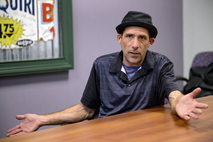 FILE - Paul Carpenter, a New Orleans magician, speaks during an interview in New Orleans, Feb. 23, 2024. Steve Kramer, the Democratic consultant behind recent robocalls that mimicked President Joe Biden's voice, said Monday, Feb. 26, he was trying to send a wake up call about artificial intelligence, not influence the New Hampshire primary. Kramer confirmed paying Carpenter 150 to create a recorded message that was sent to thousands of voters two days before the Jan. 23 primary....