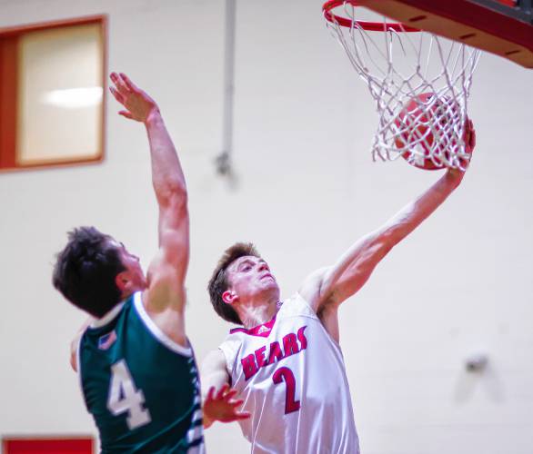 Coe-Brown guard Connor Bagnell drives to the basket against Kingswood forward Brady Moulton during the second quarter on Tuesday night.